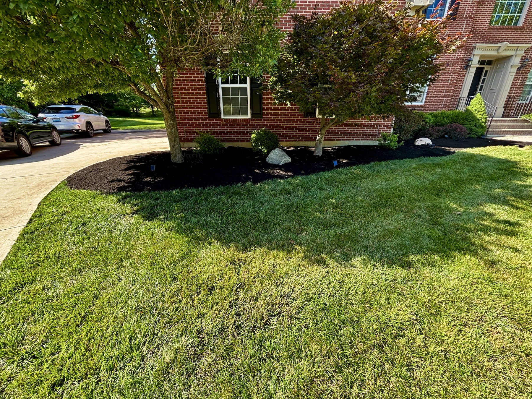Long landscaped bed along a brick home